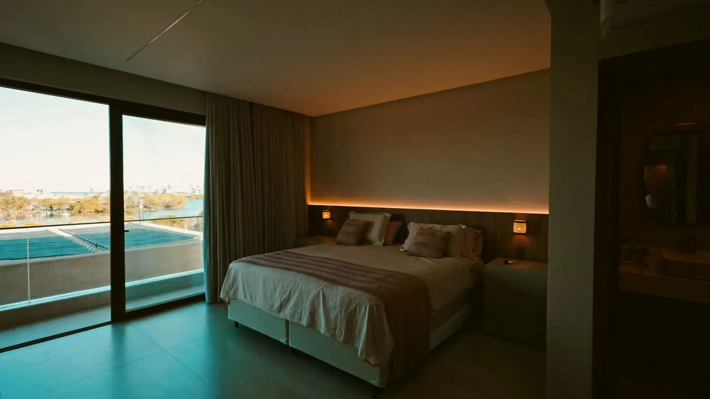Upholstered bed with cove lighting